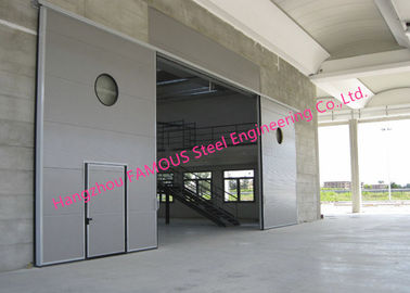 China Large Openings Vertical Sliding Industrial Garage Doors Motorised Heavy Sliding Doors With Steel Track supplier